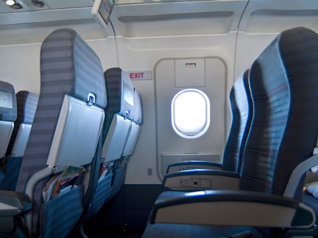 What if the emergency exit door is open while flying? Picture 1