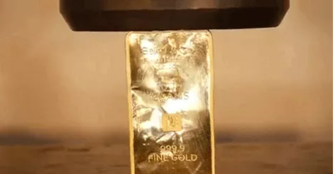 A Close-up of the 1-pound 24K Gold-molded Hydraulic Press Machine