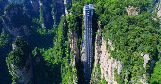 Discover an Outdoor Lift Hanging Along a Vertical Sandstone