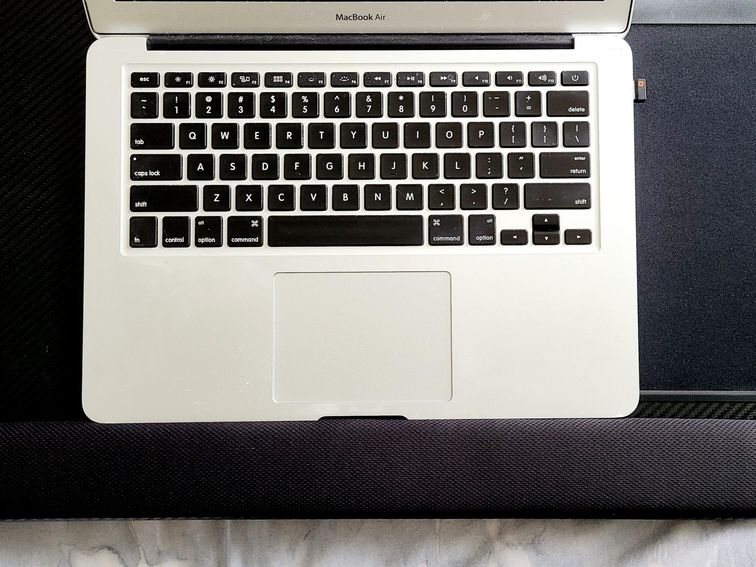 How to Work Ergonomically from Bed Even Though You're Not