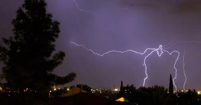 Sitting and Playing Games Under a Tree in Stormy Weather, 2