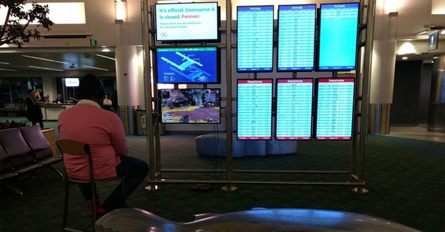 Young People 'Hack' the Airport Screen to Play the Game Apex