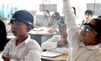 Chinese students wear a concentration meter to help parents and teachers know when they are not focused
