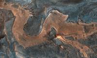 NASA imagines a whimsical dragon on Mars in a sinuous, scenic canyon