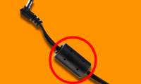 What effect does the black bureau on the laptop charger cord have?