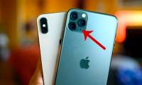 What is the effect of the round dot next to the iPhone's rear camera?
