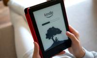 How to set up Kindle to update new books purchased in the library