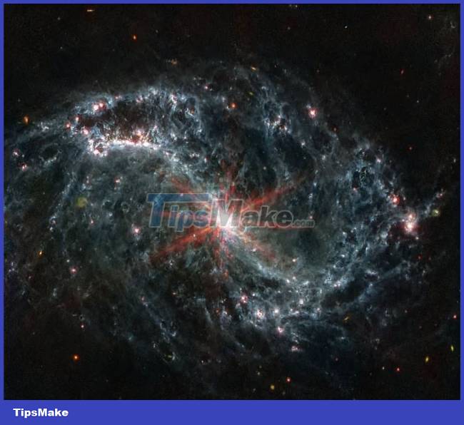 Admire the majestic spectacle of swirls of dust and gas in nearby galaxies Picture 2