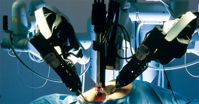 The doctor controls the robot to operate on the patient at a distance ...