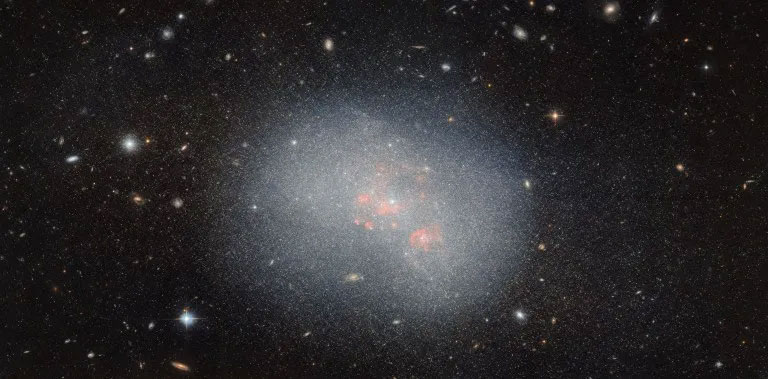 The Hubble Telescope discovered a pair of small dwarf galaxies containing many interesting features Picture 2
