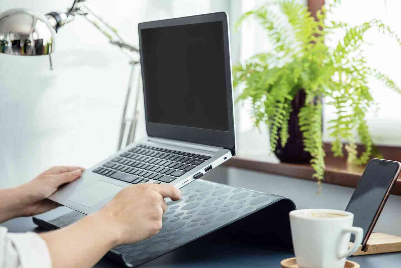 Should I Buy a Laptop Stand or a Cooling Pad?