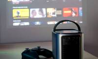 Why are projectors gradually replacing TVs in living rooms?
