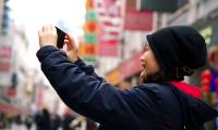 Why is street photography with a smartphone better than a DSLR camera?
