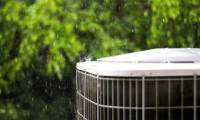 Why should you turn off the air conditioner during a storm?
