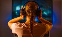 Why should you wear headphones when watching TV?